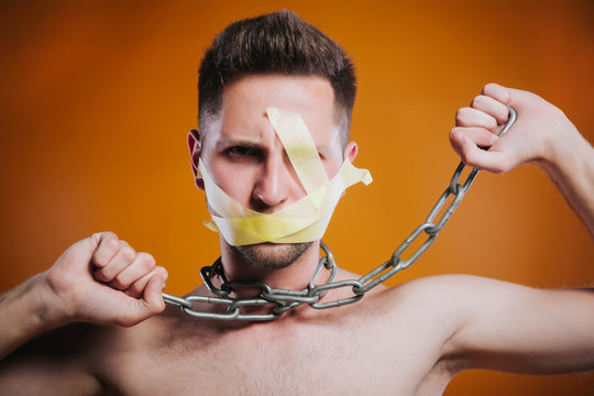 Man in captivity of his thoughts. Concept of censorship, freedom of speech, freedom of press.
