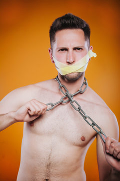 Man in captivity of his thoughts. Concept of censorship, freedom of speech, freedom of press.