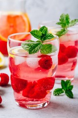 Cold drink Raspberry Lemonade with mint in glass.
