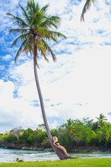 young girl on palm tree