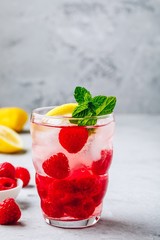 Cold drink Raspberry Lemonade with mint in glass.