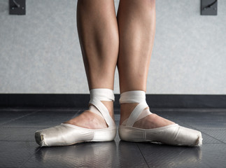 Ballerina in Ballet first position in ballet pointe shoes and bare legs  © Katherine BYC