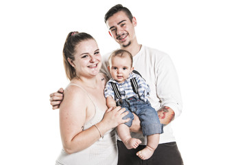 Portrait of the happy family with baby boy standing on white background.