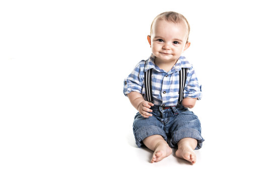 cute baby boy with one hand over white background