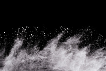 Launched white powder, isolated on black background.