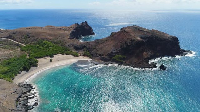 Aerial panoramic view of picturesque scenery of volcanic coast on Ua Pou island, lonely beach - South Pacific Ocean, Marquesas Islands, landscape panorama of French Polynesia from above