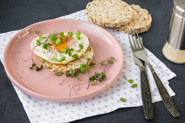 Breakfast fried egg, micro greens.