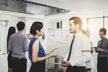 Obraz premium New Asian business operators talking and discussion with SME specialist advisers explaining after seminar and meeting about how to success and achievement