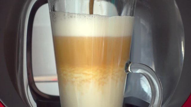 Making coffee latte or cappuccino at automatic machine macro