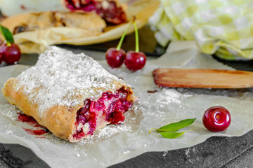 A piece of delicious freshly baked homemade cherry strudel.