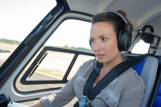 close up portrait of young woman helicopter pilot