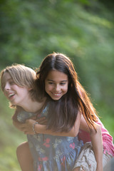 One Friend Carrying Another Laughing