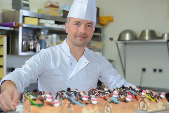 Baker Holding Tray Of Pastries