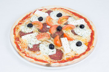 Delicious Spicy Pizza With Sausage, Cheese, Chopped Tomato And Black Olive On White Plate