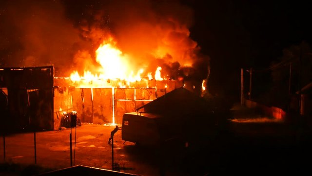 Man Trying To Rescue A Caravan From Fire