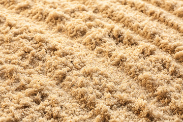 Wet sand with pattern, closeup