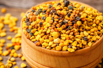 bee pollen in wooden bowl