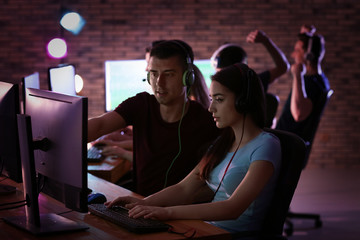 Young people playing video games at tournament