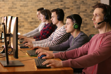 Young people playing video games at tournament