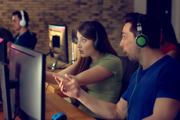 Young people playing video games at tournament