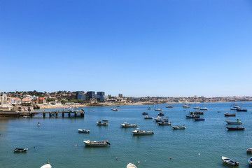 Fototapeta na wymiar View of the beautiful Cascais bay. W|ith the town of Cascais in background in a summer day. Cascais, Portugal June 2018