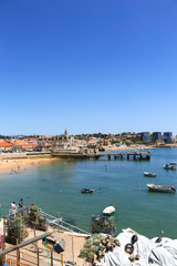 Fototapeta na wymiar View of the beautiful Cascais bay. W|ith the town of Cascais in background in a summer day. Cascais, Portugal June 2018