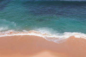 Aerial view of sandy beach with waves perfect spot for surfing. Drone photo 