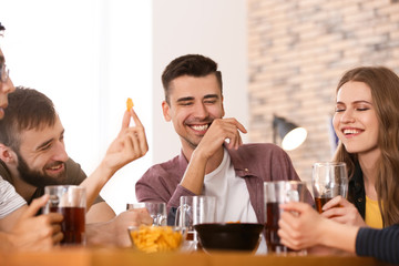 Friends drinking beer in bar