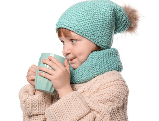 Cute little girl in warm clothes and with cup of hot cocoa drink on white background