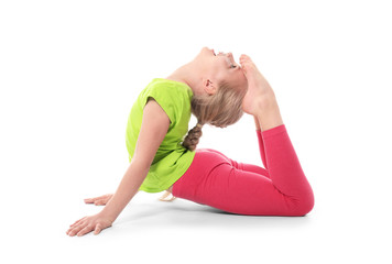 Little girl practicing yoga on white background