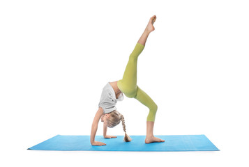 Little girl practicing yoga on white background