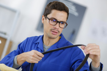 mechanic holding a strip