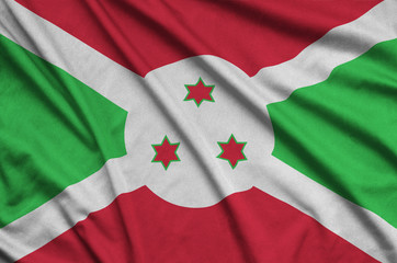 Burundi flag  is depicted on a sports cloth fabric with many folds. Sport team banner