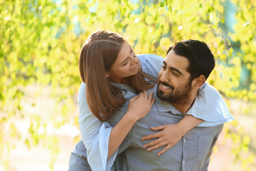 Fototapeta premium Happy young couple in park on spring day