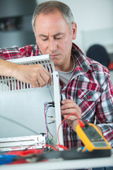 man checks the electrical instalation