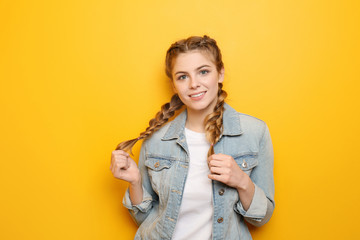 Beautiful young woman on color background