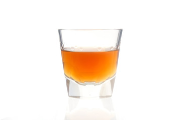 Cocktail Glass with brandy or whiskey - Small Shot. Isolated on white background