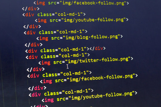 HTML with Bootstrap code of sharing website elements for most popular social networks. Web development source code abstract screen. Shallow depth of field. Code is created by myself.