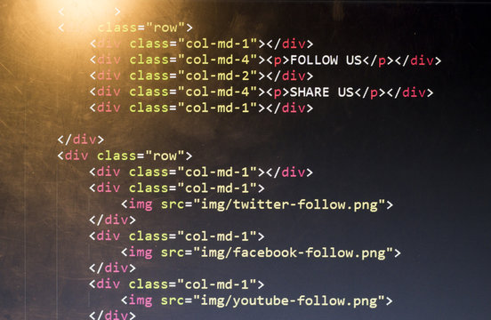 HTML with Bootstrap code of sharing website elements for most popular social networks. Web development source code abstract screen. Shallow depth of field. Code is created by myself.
