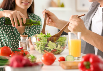 Friends cooking together in kitchen