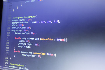 Web designer CSS3/LESS/SASS code close up. Styling network website. Abstract information technology modern background. Concept screen of web developer.