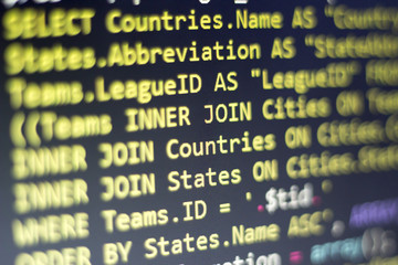Web developer PHP code close up. Macro shot of complicated SQL query to database. Abstract...