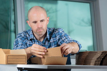 man preparing boxes for delivery