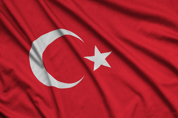 Turkey flag  is depicted on a sports cloth fabric with many folds. Sport team banner