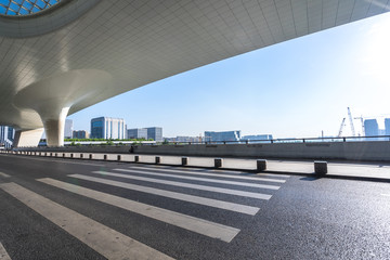 asphalt road with modern office building in urban