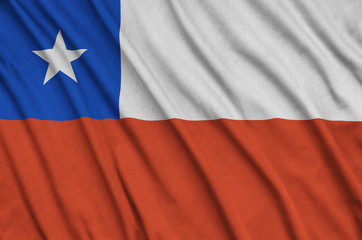 Chile flag is depicted on a sports cloth fabric with many folds. Sport team banner