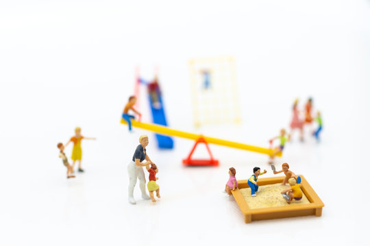 Miniature people : children playing together. Image use for happy family day concept.