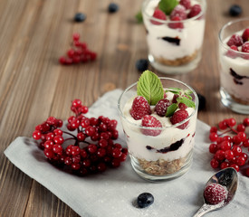 Natural yogurt with fresh berries and muesli. Healthy dessert.