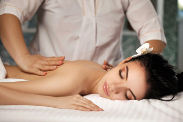 Fototapeta na wymiar Relaxed woman receiving massage
