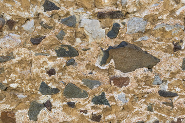 Texture of stone wall from different stones, background